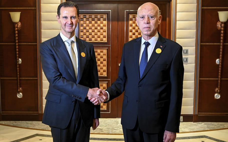 In this photo provided by the Tunisian Presidency, Tunisian President Kais Saied, right, shakes hand with Syrian President Bashar Assad, in Jeddah, Saudi Arabia, during the Arab summit, Friday, May 19, 2023. (Slim Abid/Tunisian Presidency via AP)