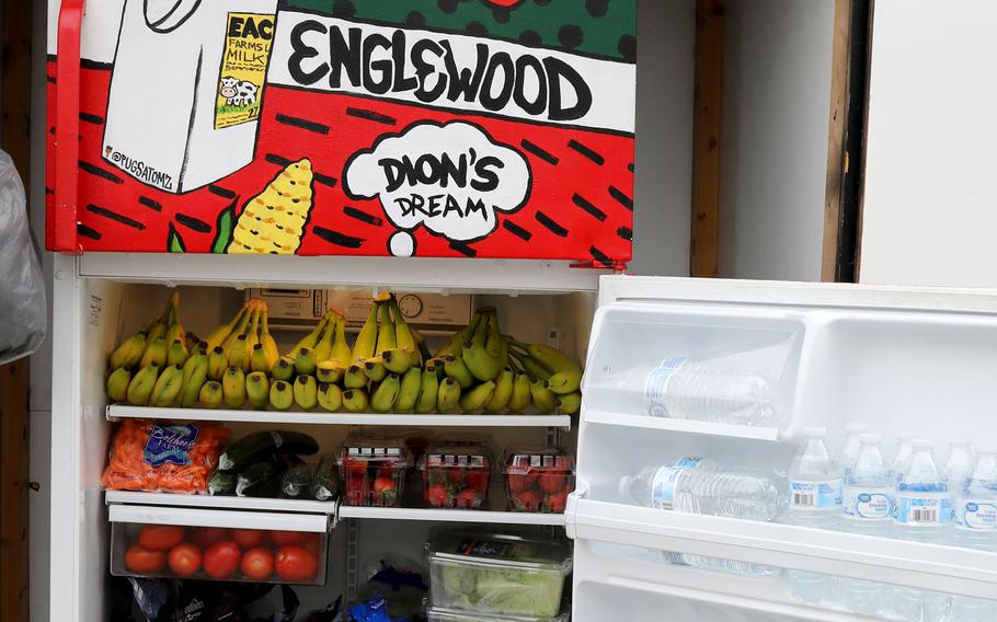 Project Dream Fridge, an outside public refrigerator with fresh vegetables, fruits and bottles of water, in the 5600 block of south Racine in Chicago, April 26, 2022.