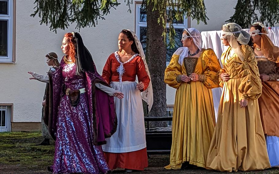 At front, from left, Amy Smolinski and Emily Lamb join fellow actors with KMC Onstage during an outside performance of "Medea" at Kleber Kaserne, Kaiserslautern, Germany, Feb. 14, 2022, after an equipment malfunction triggered the spinkler system, dousing the stage and equipment. 