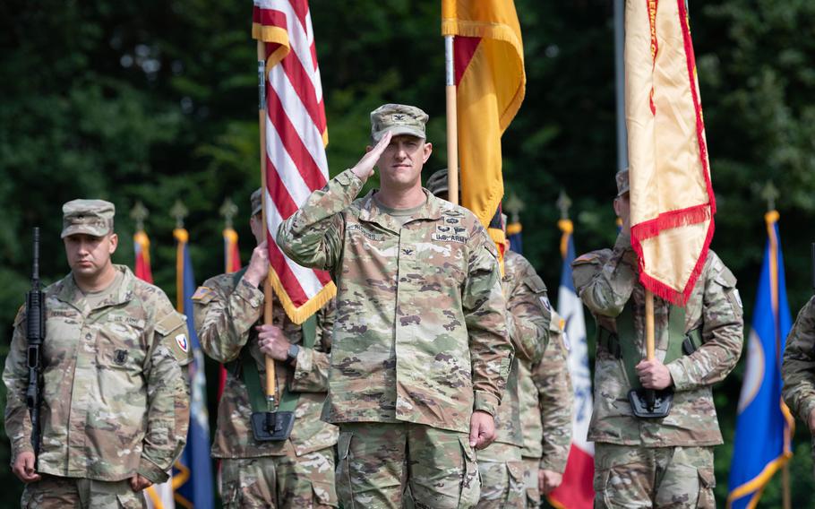 Col. Jeffery Higgins salutes after assuming command of U.S. Army Garrison Rheinland-Pfalz at a ceremony in Kaiserslautern, Germany, on July 11, 2024.