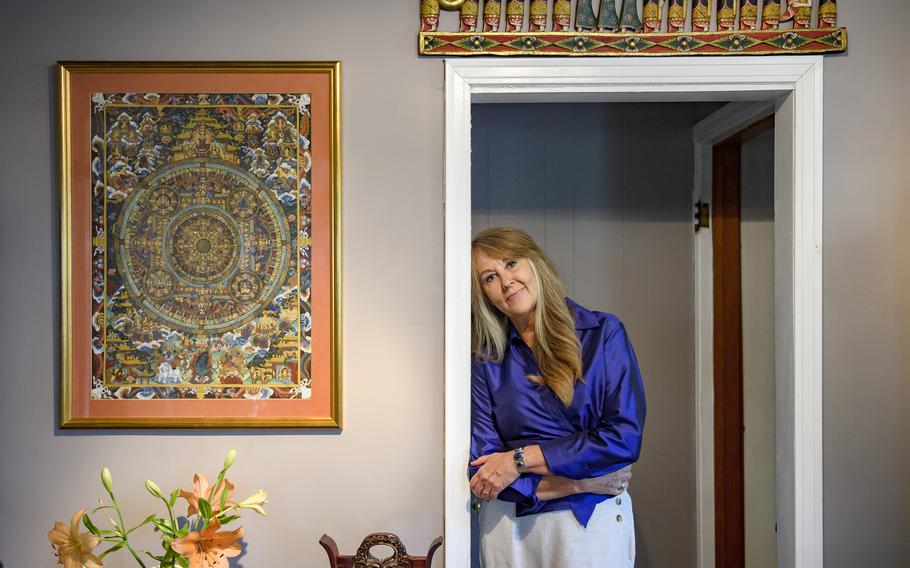 Jane Fogel at home in Oakmont, Pa., with mementos of traveling the world with her husband, Marc.