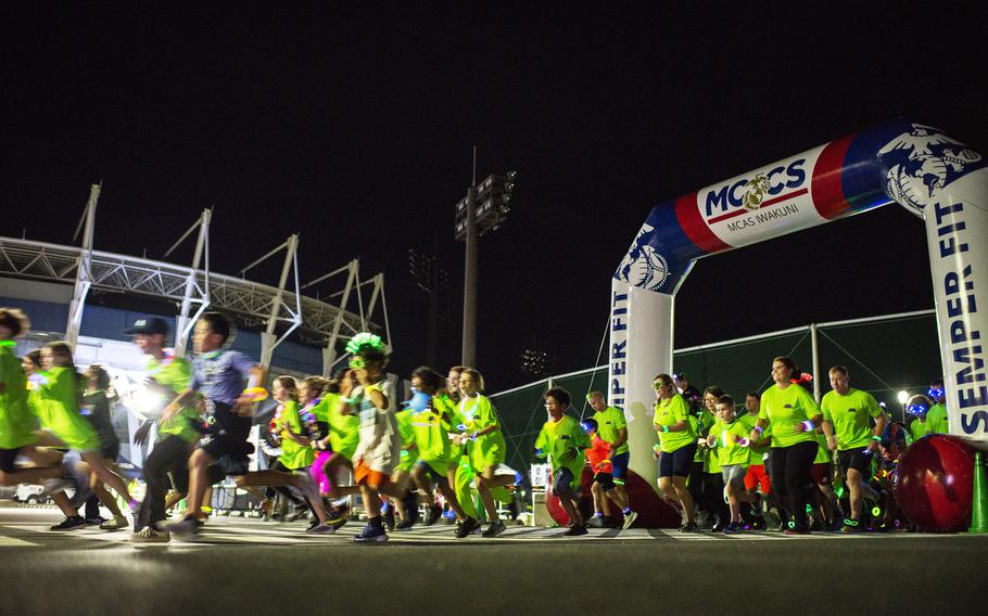 A neon fun run kicks off at Atago Sports Complex in Iwakuni city, Japan, Saturday, June 24, 2023.