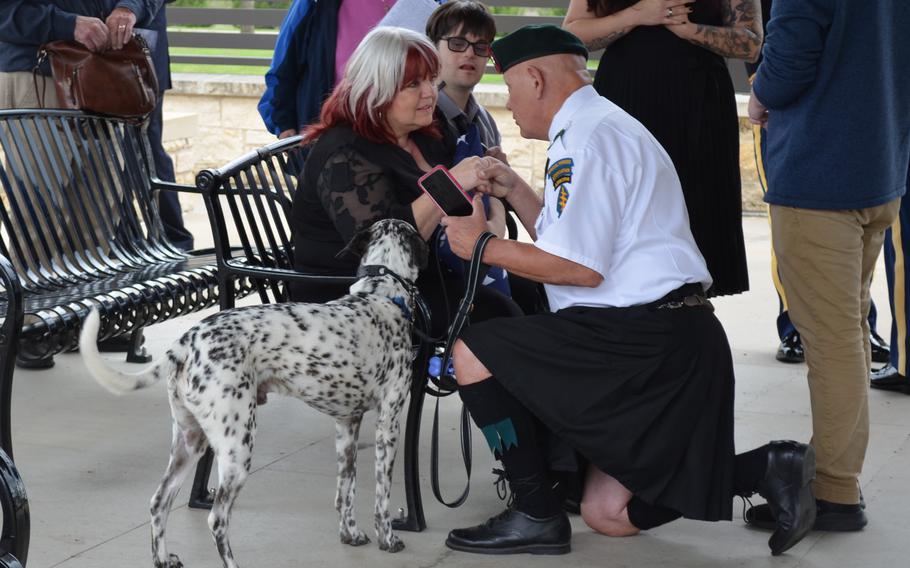 Cheri Stripling, the great-niece of Army Air Forces 2nd Lt. Wayne Dyer, speaks with Richard Briggs, a military veteran, at a burial service for Dyer held Monday, April 10, 2023, at Central Texas State Veterans Cemetery in Killeen, Texas. Dyer died during combat May 29, 1944, and the Defense POW/MIA Accounting Agency identified his remains in September.