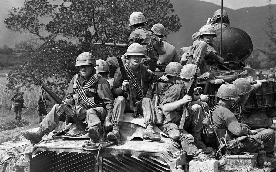 Soldiers on a tank in Vietnam.