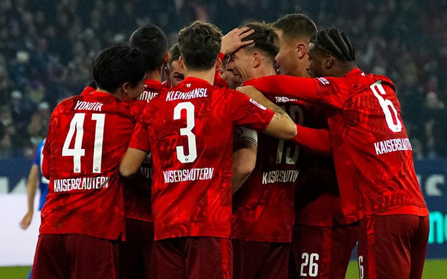 FC Kaiserslautern players huddle during a game.  
