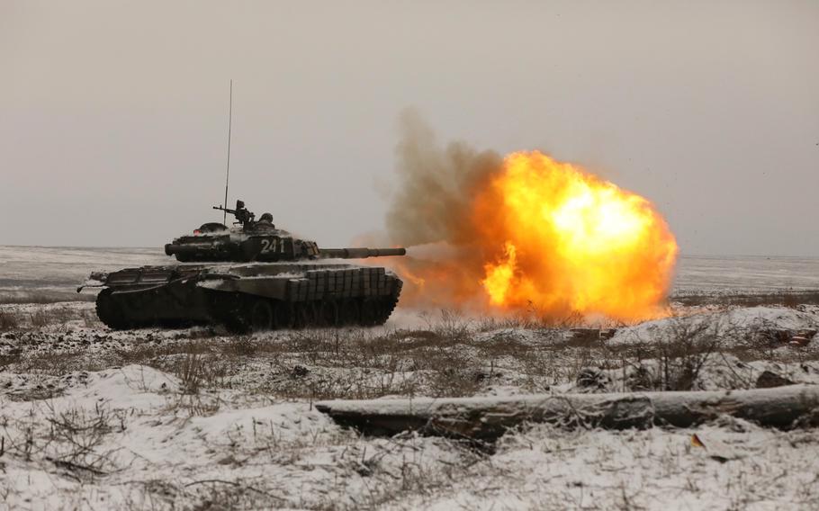 A Russian tank T-72B3 fires as troops take part in drills at the Kadamovskiy firing range in the Rostov region in southern Russia, on Jan. 12, 2022.