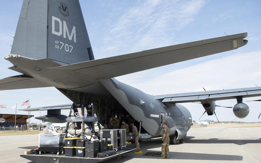 U.S. Airmen from the 79th Rescue Squadron and the 571st Mobility Support Advisory Squadron work to load the LIFT aircraft eVTOL onto a C-130J Super Hercules from Davis-Monthan Air Force Base, Arizona, at the Springfield-Beckley Municipal Airport, Ohio, March 23, 2021.  This marked the first time the LIFT electrical vertical takeoff and landing aircraft, or eVTOL, was transported using military aircraft.