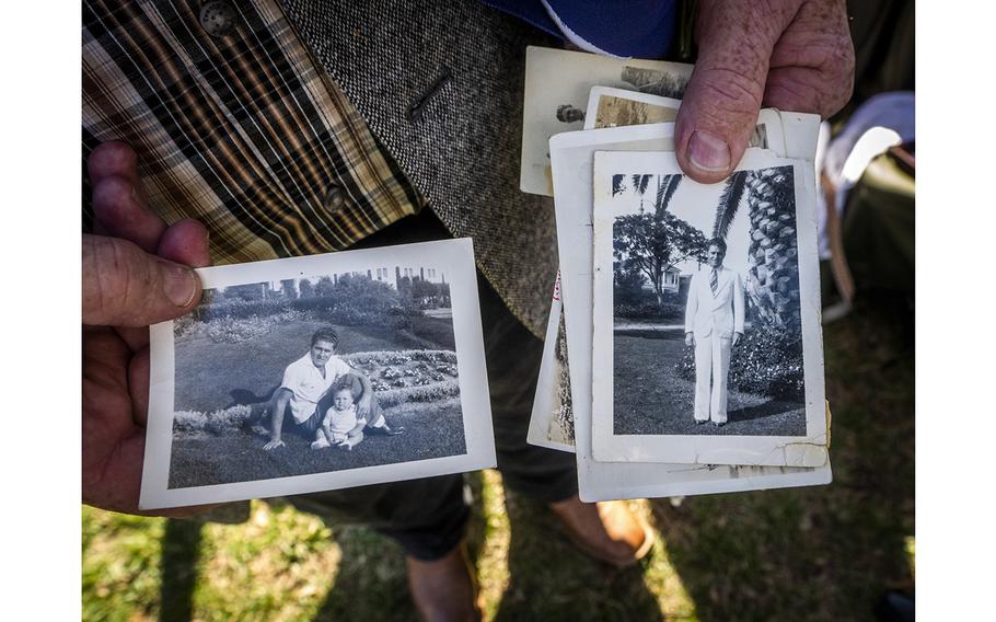 Gary Bishop displays family snapshots of Herman Schmidt, Bishop’s granduncle who was killed during the Dec. 7, 1941, attack on Pearl Harbor while serving aboard the USS Oklahoma. 