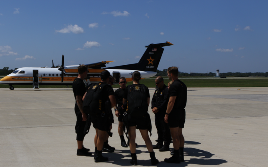 Members of the U.S Army Golden Knights gather and talk.