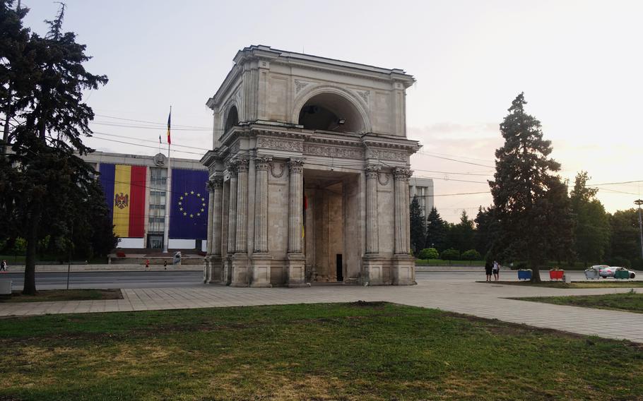 The Triumphal Arch and the Government House, draped in the Moldovan and European Union flags, in Chișinău, Moldova. The country is seeking closer integration with Europe and eventual membership in the European Union.