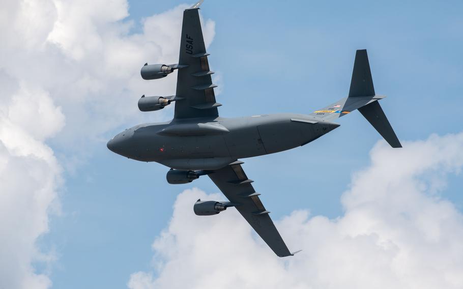 A C-17 Globemaster III assigned to the C-17 East Coast Demonstration team flies over Joint Base Charleston, S.C., Saturday, April 20, 2024, as part of the C-17 demonstration team act during the Charleston Airshow.  