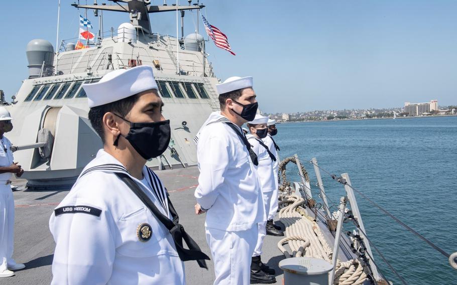 Sailors man the rails as Freedom-variant littoral combat ship USS Freedom on April, 12, 2001.