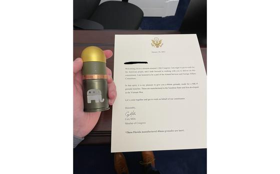 Newly elected Rep. Cory Mills (R-Fla.) passed out grenades Thursday to other members of Congress, along with a note on his office letterhead emphasizing that the ordnance was made in Florida.