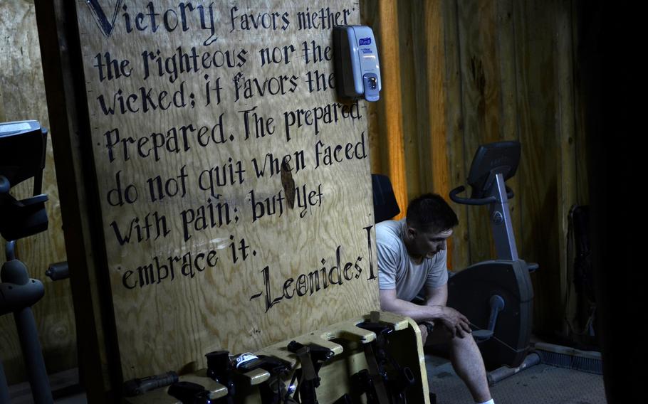 Capt. David Stroud, commander of Team Apache with the 1st Battalion, 501st Infantry Regiment, takes a short break during a workout in the gym at Combat Outpost Sabari, Khost province, Afghanistan.