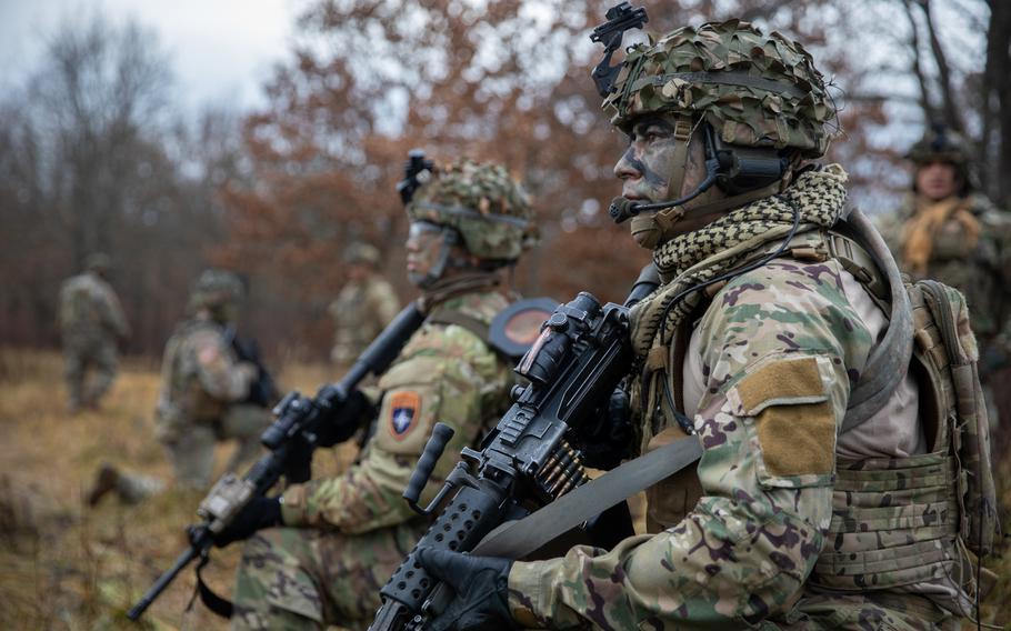 U.S. Army National Guard soldiers with 3rd Battalion, 161st Infantry Regiment, take a break during an exercise at Bemowo Piskie Training Area, Poland, Nov. 8, 2021. Poland recently called for more NATO troops to be sent to the alliance's eastern flank.