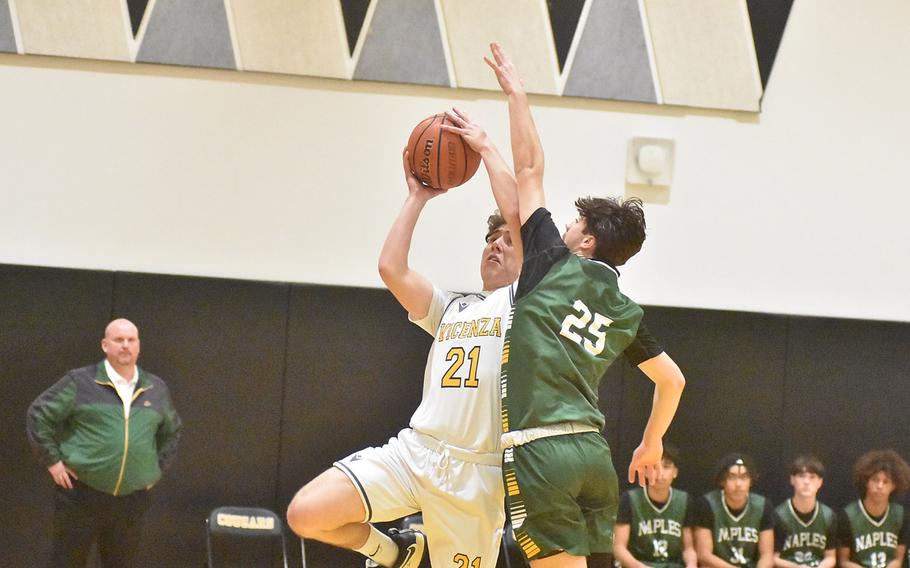 Vicenza’s Jayden Stimle is fouled by Naples’ Jettyn Jones in the Cougars’ 65-49 victory Friday, Feb. 2, 2024, over the Wildcats in Vicenza, Italy.