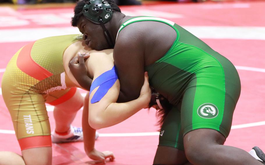 Kubasaki's Aaron Laborn gains the edge on Matthew Araya of St. Mary's at 215 pounds.