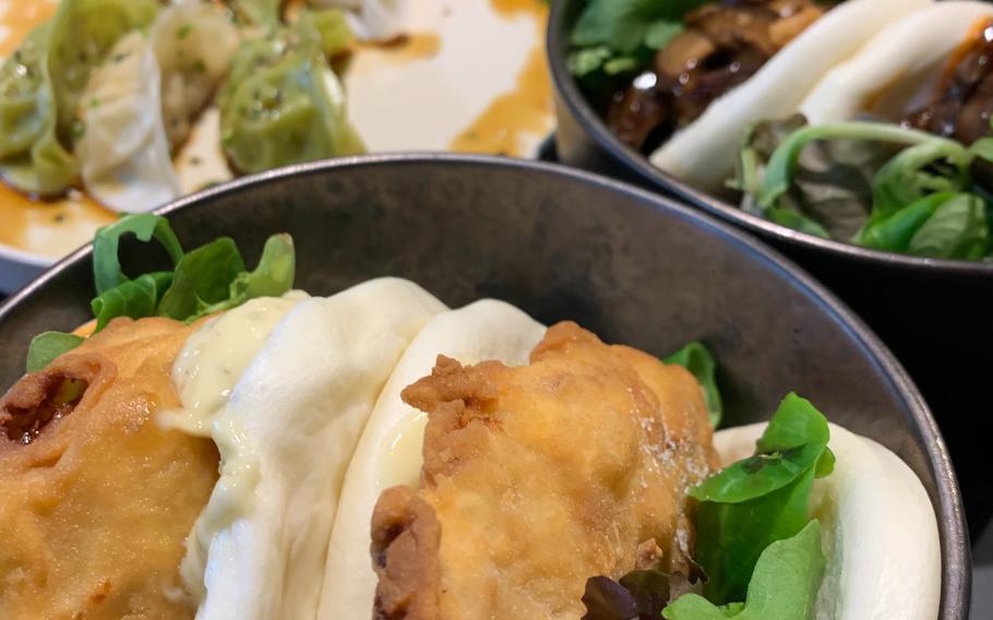 A highlight of the Staj Noodle Bar menu is a selection of bao, an Asian steamed bread roll, including this fried chicken version with aioli.