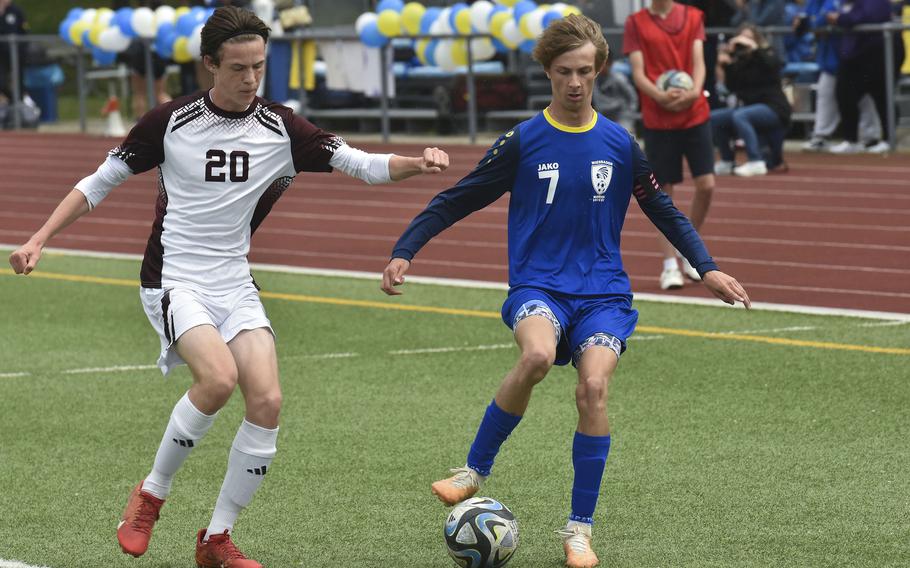Wiesbaden senior Jacob Goodman dribbles the ball around Vilseck sophomore Mason Money during a game in Wiesbaden, Germany, on May 4, 2024.