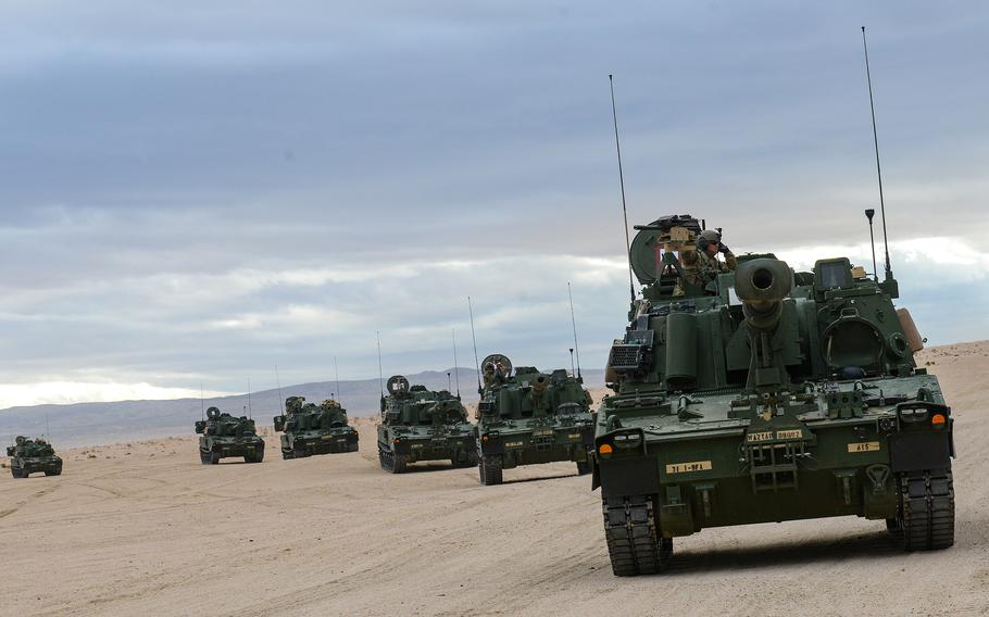 Soldiers with the Army’s 1st Battalion, 9th Field Artillery Regiment of the 3rd Infantry Division’s 2nd Armored Brigade Combat Team convoy their M109A7 Paladin howitzers across the National Training Center at Fort Irwin, Calif., during a training exercise Feb. 27, 2023. The M109A7 is the Army’s newest howitzer, and 2nd ABCT will deploy them to Europe late this summer.