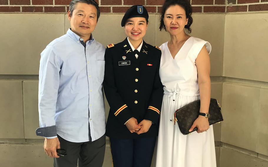Then-Army 2nd Lt. Kirsten Kwon poses with her father, Tae Kwon, and her mother, Mi Kwon. 
