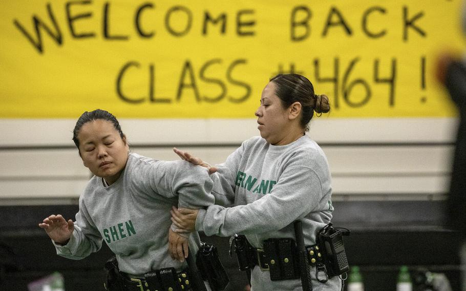 Los Angeles County Sheriff recruits Class 464 go through defensive tactics class at STAR Center Academy in Whittier, Calif., on Nov. 30, 2022, after returning to the academy after a crash that landed 25 of them in the hospital earlier in November.