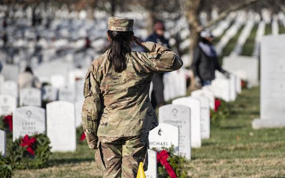 Soldiers assigned to 832nd Ordinance Battalion attend the 32nd Wreaths Across America Day at Arlington National Cemetery, Arlington, Va., Dec. 16, 2023. The soldiers came to ANC to remember U.S. Army Sgt. James Slape from 832nd Ordinance Battalion and others interred in Section 60. On this day, more than 30,000 volunteers placed approximately 260,000 wreaths at every gravesite and niche column at Arlington National Cemetery. (U.S. Army photo by Elizabeth Fraser / Arlington National Cemetery / released)
