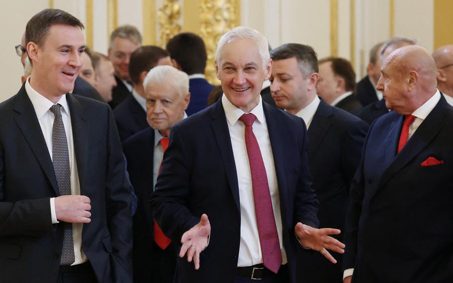 In this pool photograph distributed by Russian state-owned Sputnik agency, Russian Minister of Agriculture Dmitry Patrushev, left, and First Deputy Prime Minister of the Russian Federation Andrei Belousov, center, talk before the inauguration ceremony of Russian President Vladimir Putin in the Kremlin in Moscow on May 7, 2024. Putin on Sunday, May 12, 2024, moved to replace Defense Minister Sergei Shoigu in a major shake-up to Russia’s military leadership more than two years into its Ukraine offensive. Putin proposed economist Belousov as Shoigu’s replacement, according to a list of the ministerial nominations published by the Federation Council, Russia’s upper house of parliament.