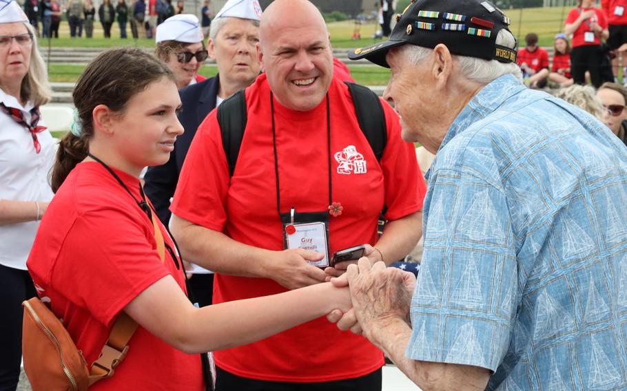Veteran Les Jones greets visitors from Kenosha, Wis., at the World War II Memorial on the National Mall in Washington, D.C., on Memorial Day, May 29, 2023.