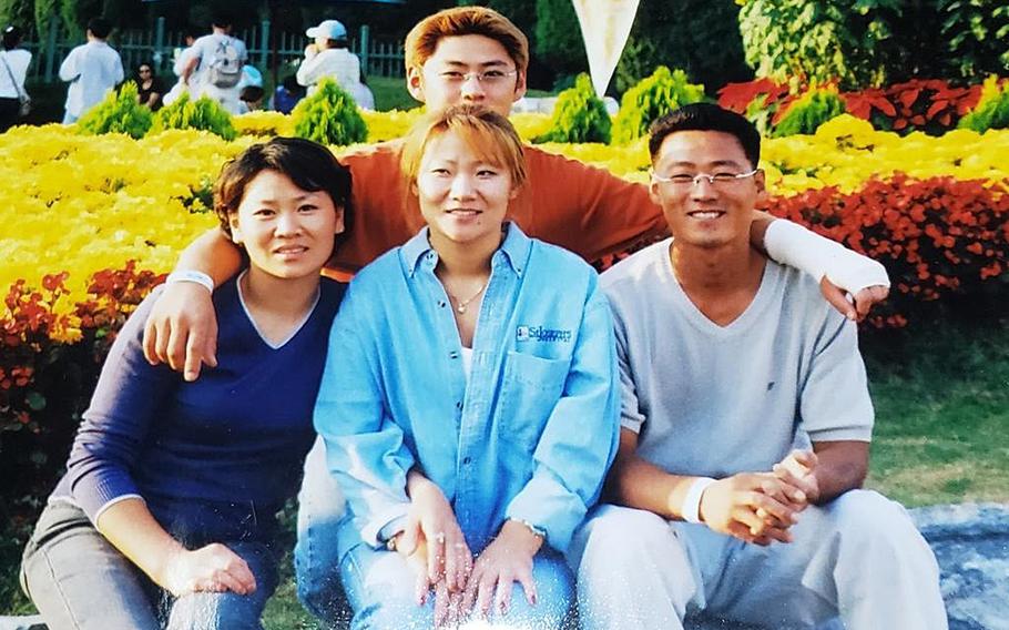 Hyon Chu DuCharme, center, poses with her siblings in this undated family photo. From left: Yae-Wong Hwang, Hyeon-Mi Hwang and Sae-Min Hwang.