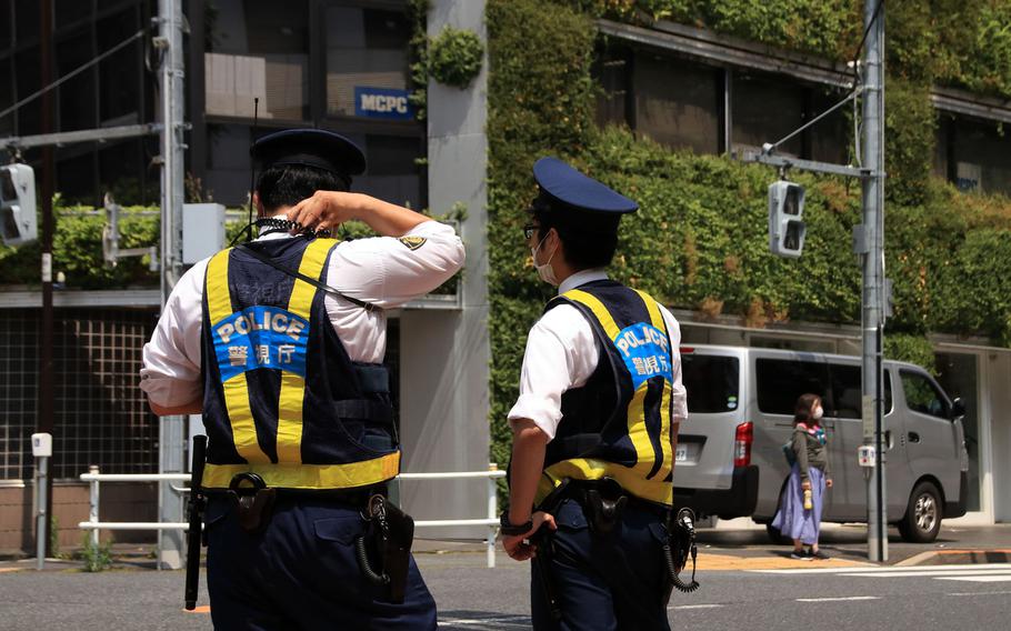 Tokyo Metropolitan Police officers patrol near the National Diet building, May 28, 2020. 