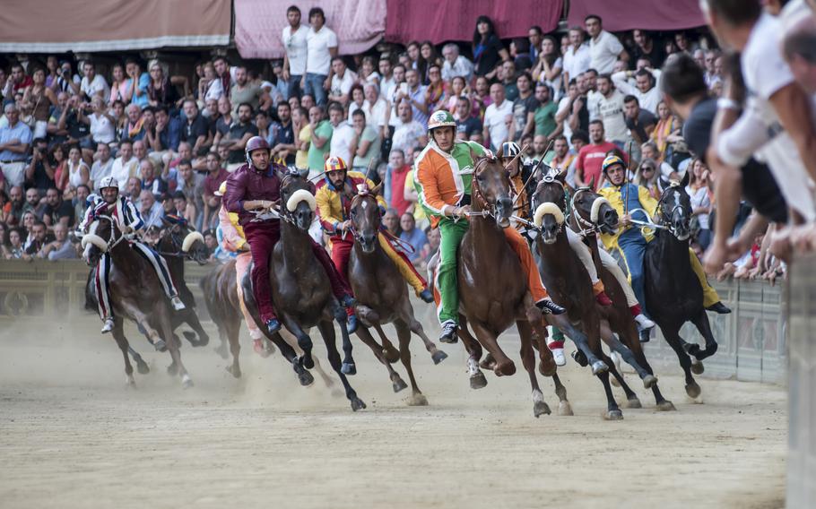 The Palio di Siena horse race takes place twice a summer on Siena, Italy’s Piazza del Campo. 