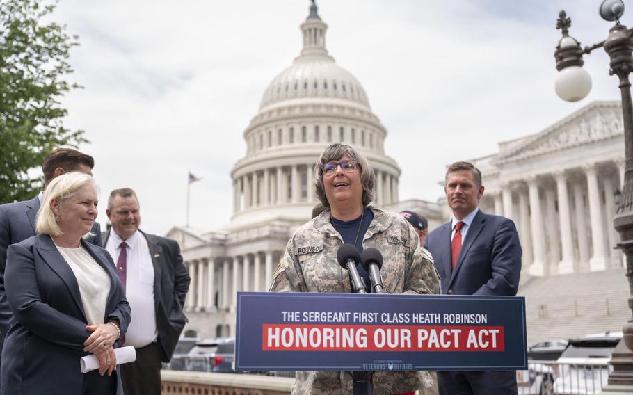 Sgt. 1st Class Heath Robinson’s mother-in-law, Susan Zeier, speaks at a press conference Thursday, June 16, 2022, announcing the Senate’s passing of the PACT Act. Zeier said she began wearing Robinson’s Army jacket after Rosie Torres, co-founder of the advocacy group Burn Pits 360, said family members of the 9/11 first responders gained momentum pushing for legislation to help them after they began wearing firefighter and police jackets.