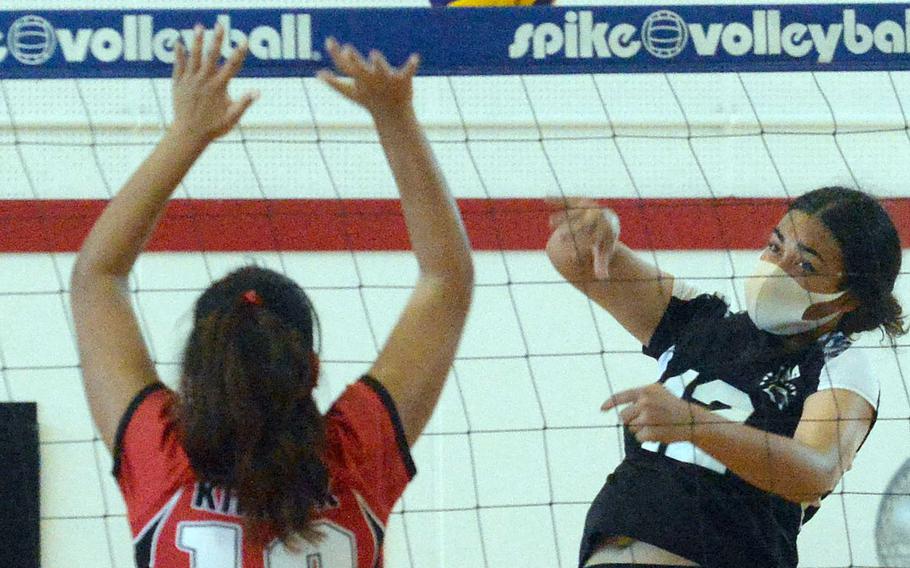 Zama's Kierstyn Aumua spikes against Nile C. Kinnick's Cierra San Nicolas during Saturday's DODEA-Japan volleyball match. The Red Devils won in four sets.