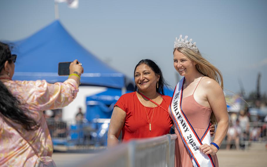 Members of the audience ask Marine Corps Lt. Riley Tejcek, Ms. Military 2023, for a personal photo during the Southern California Air Show 2023 on April 23, 2023, at March Reserve Air Base in Riverside, Calif.