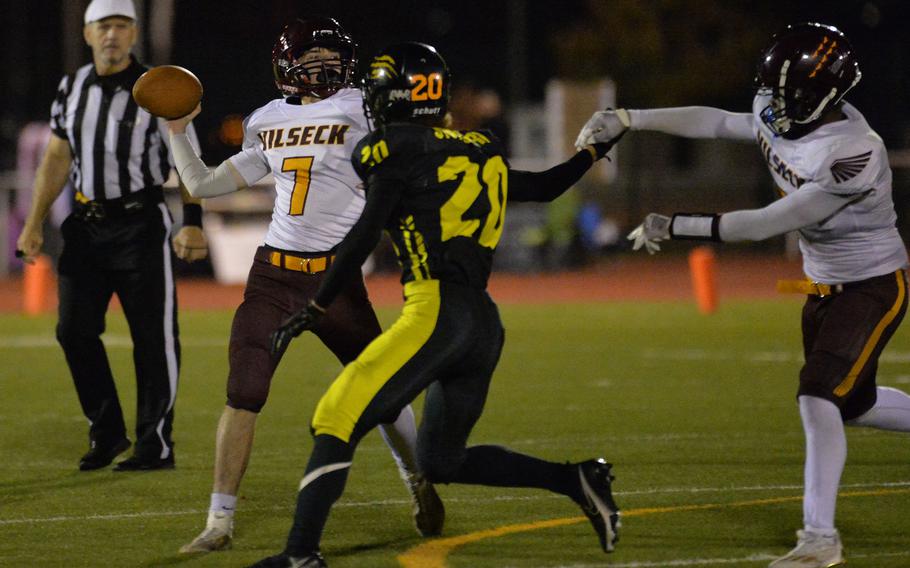 Vilseck quarterback Jonathan Bullock gets off a pass despite pressure by Stuttgart’s Marcel Mailey. Stuttgart beat Vilseck 51-12 in the DODEA-Europe Division I football championship game at Kaiserslautern, Germany, Oct. 29, 2022.