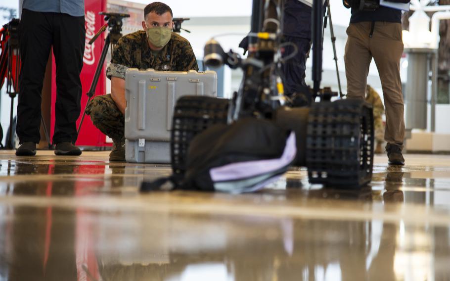 Staff. Sgt. Keith Lowe, an explosive ordance disposal technician with Marine Wing Support Squadron 171, operates a robot at Marine Corps Air Station Iwakuni, Japan, Friday, July 9, 2021. 