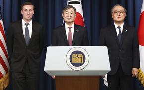 From left, U.S. National Security Advisor Jake Sullivan, South Korean National Security Adviser Cho Tae-yong and Japanese National Security Secretariat Secretary-General Takeo Akiba pose before a joint news conference in Seoul on Dec. 9.