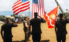 From left to right, Lt. Col. Andrew Gourgoumis, Lt. Col. Adam R. Sacchetti, commander of 1st Battalion, 3rd Marines, and Col. Timothy S. Brady Jr, commander of 3rd Marine Littoral Regiment, salute during the battalion’s redesignation ceremony at Marine Corps Base Hawaii, June 23, 2022. 