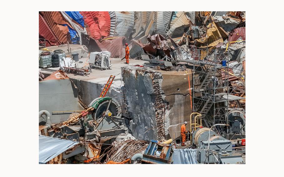 Salvage experts continue to clear the large amount of wreckage on the bow of the container ship Dali, twelve weeks after the collapse of the Francis Scott Key Bridge, on June 19, 2024, in Baltimore. 