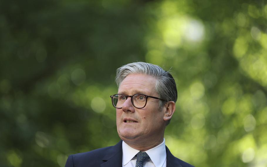 Britain’s Prime Minister Keir Starmer in front of trees.