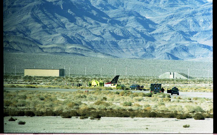 The crash site of an Air Force Thunderbird F-16C jet on Feb. 14, 1994. Capt. Thomas H. Lewis III, who was training for his first season with the Thunderbirds U.S. Air Force Air Demonstration Squadron, suffered a broken leg and other injuries. Witnesses said Lewis, 32, apparently couldn't bring the jet out of a maneuver, possibly losing power during a steep climb. 