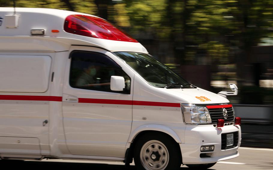 A Japanese ambulance drives through Yokohama, Japan, May 8, 2020.