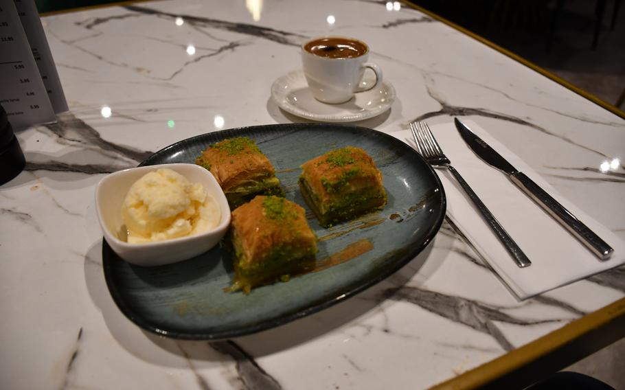 Turkoman Bar and Grill's nine desserts include baklava with a side of ice cream, paired here with a Turkish coffee on May 9, 2023.