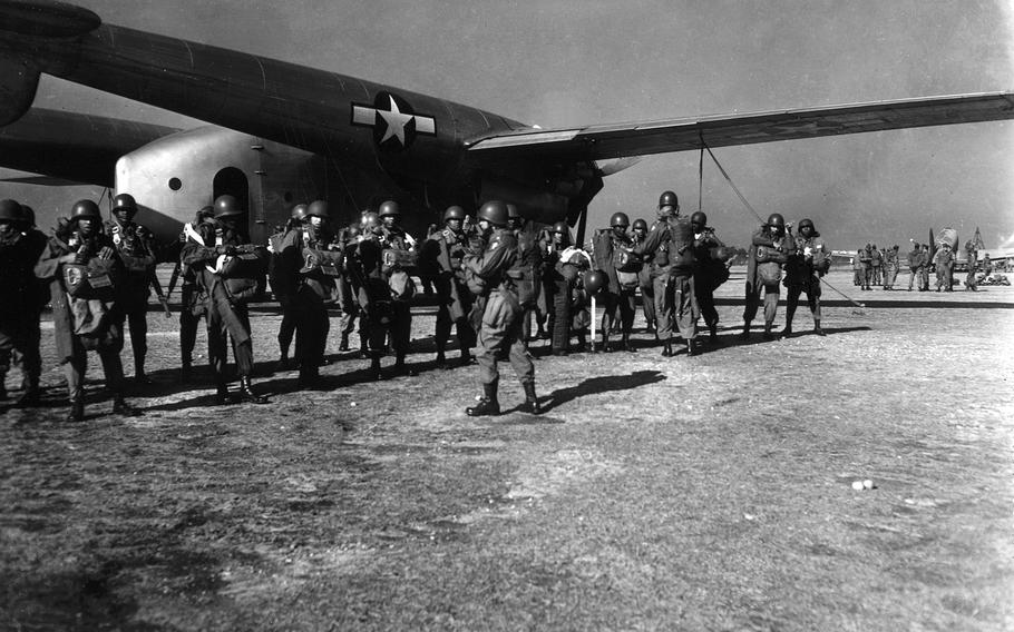 Members of the 555th (Triple Nickel) Parachute Infantry Battalion are briefed before takeoff from Fort Dix, N.J., in 1947.