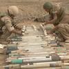 HED: Ready to blow, 2002

Kandahar, Afghanistan, Feb. 25, 2002: Explosive ordnance experts attach explosives to Soviet rockets for the purpose of blowing up the munitions. U.S. Navy Petty Officer 1 Brian McMullen of the Navy's Explosive Ordnance Detachment Mobile Unit 8 works with two Norwegian EOD experts, Cpl. Kim  Soderstrom, center, and Cpl. Kjarten Snorrason. A multi-national explosive ordinance demolition crew of American, Canadian and Norwegian worked to permanently dispose of a cache of some 2,400 57 mm Russian-made rockets found two miles from Kandahar Airfield. 

META TAGS: U.S. Navy; U.S. Army; EOD; Wars on Terror; Operation Enduring Freedom; 