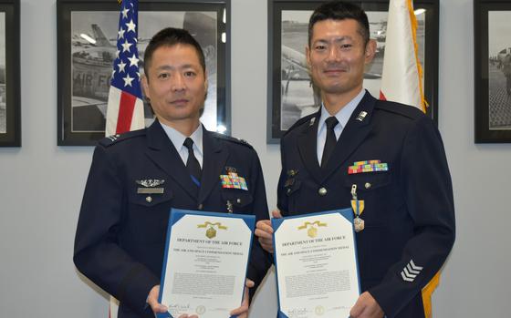 The U.S. 5th Air Force awarded Air and Space Commendation Medals to Maj. Ken Yamashita, left,  and Tech. Sgt. Atushi Oyaizu  of the Japan Air Self-Defense Force for helping rescue a pair of injured American airman on the island of Tinan on Feb. 17, 2023. 