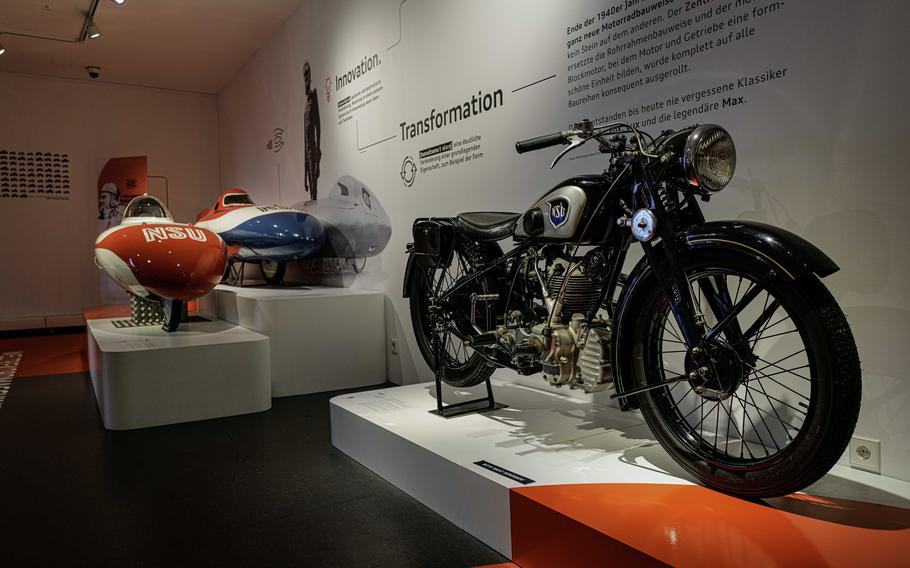 A 1951 NSU Prototype, right, stands next to the NSU Baumm test models at the German Motorcycle Museum in Neckarsulm, Jan. 21, 2024. The NSU Baumm III, left, earned a fuel economy record, achieving almost 208 miles per gallon in 1956.