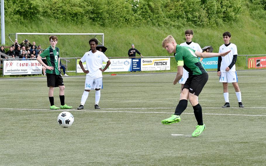 Naples midfielder Henri Schneider converts a penalty during the Wildcats' Division II semifinal against Marymount at the DODEA European soccer championships on May 17, 2023, at VfR Baumholder's stadium in Baumholder, Germany.