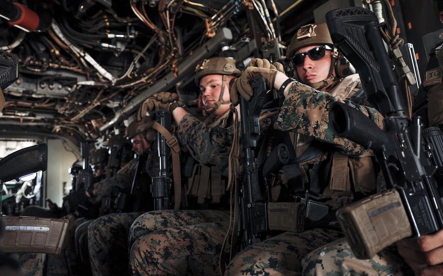 Members of the 3rd Marine Littoral Regiment prepare to take off in an MV-22 Osprey at Marine Corps Air Station Kaneohe Bay, Hawaii, Aug. 13, 2022. 